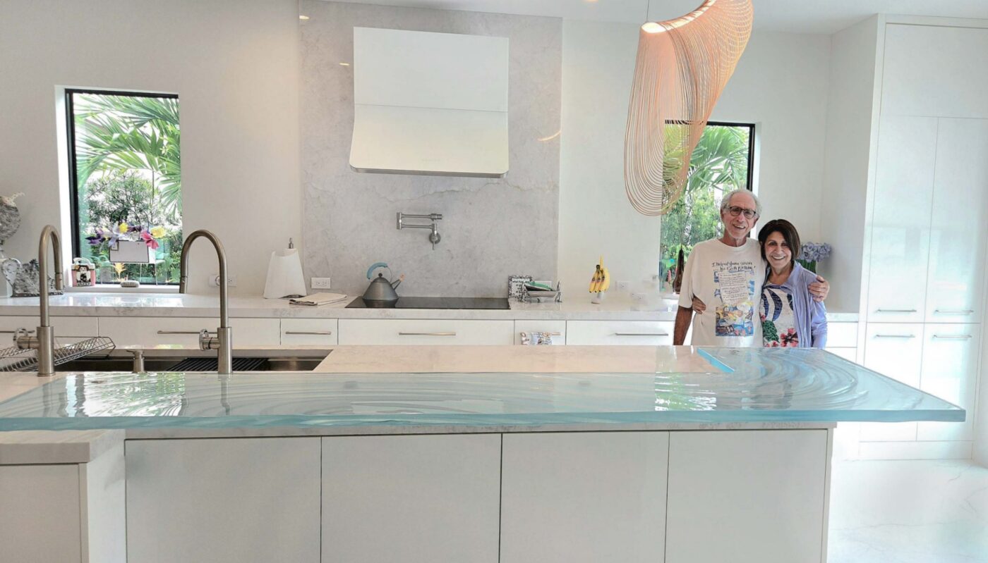 Cute couple in Jupiter, Florida enjoying new 1.5" thick trextured glass countertop from Downing Designs