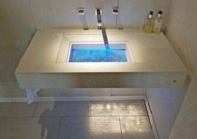 Custom Concrete and Glass Floating Bathroom Sink in Tampa Florida Downing Designs Tampa Florida LED Lights Modern Bath showroom