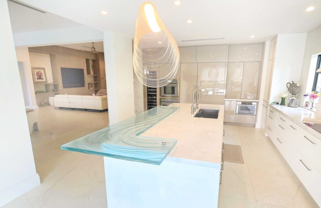 1.5-inch thick low-iron custom glass bar top with polished edge in Palm Beach County residence