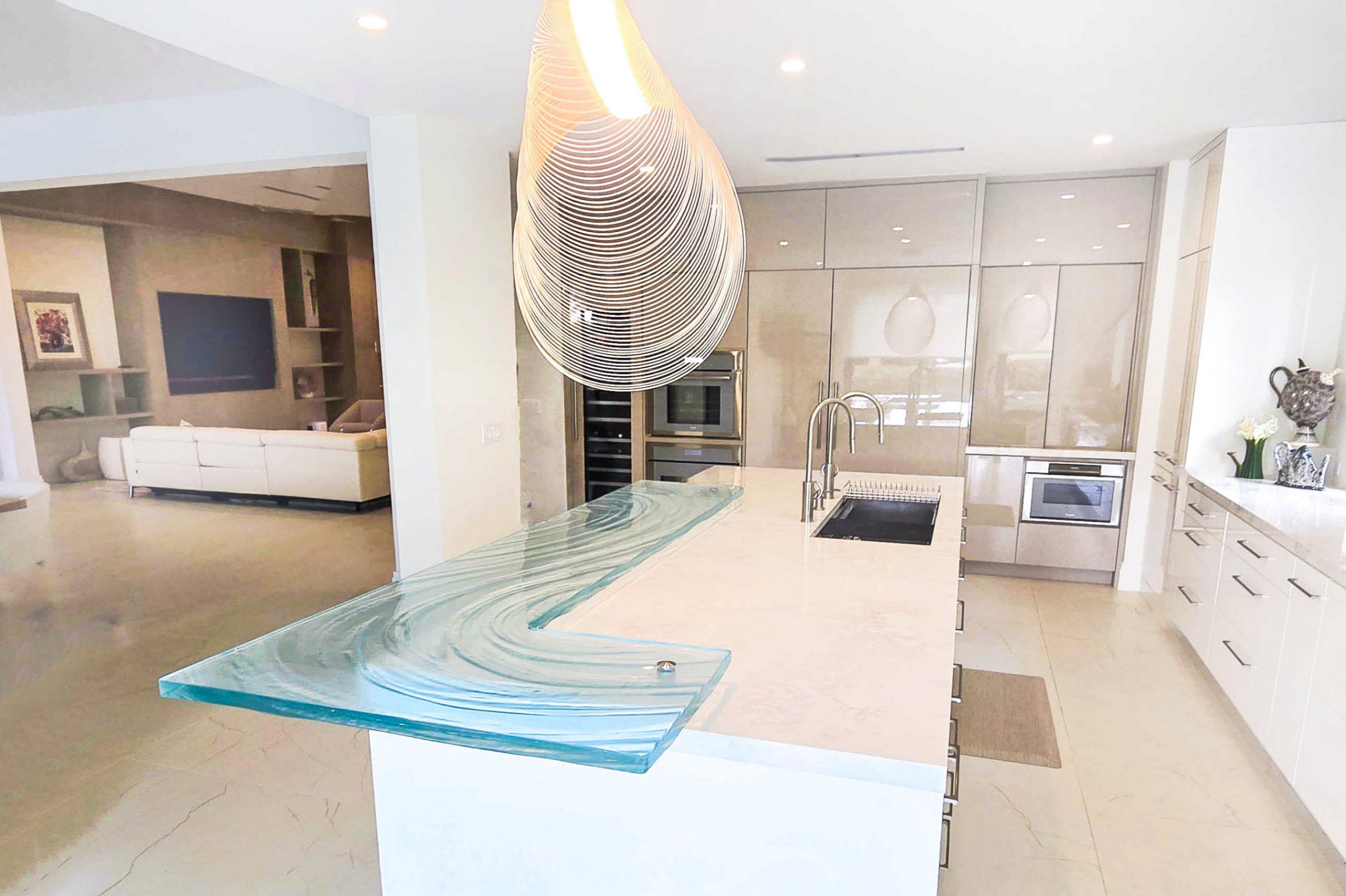 West Palm Beach glass bar top on island countertop with textured glass L-shape by Downing Designs