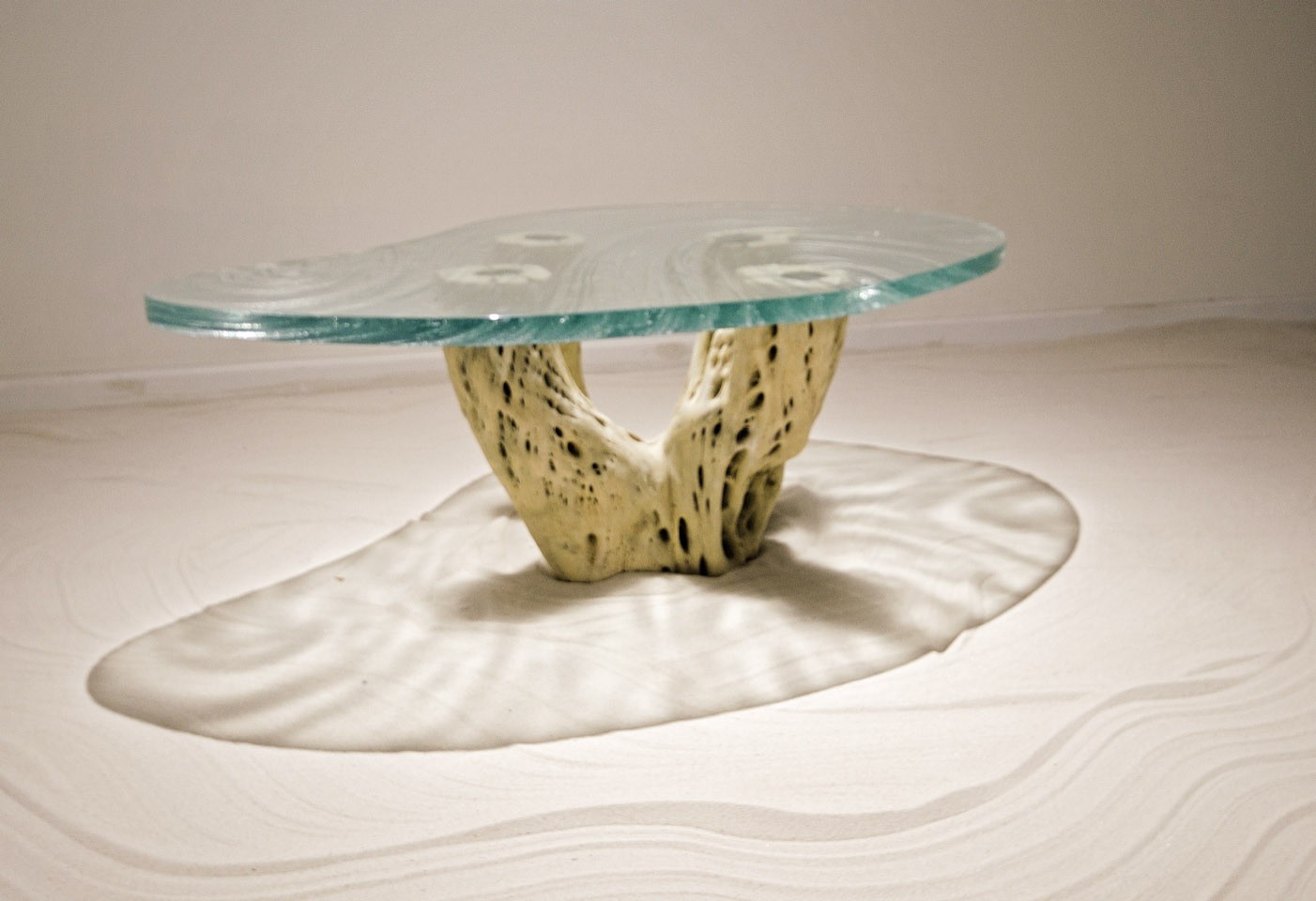 Glass table top with SORAA downlighting casting shadows onto floor