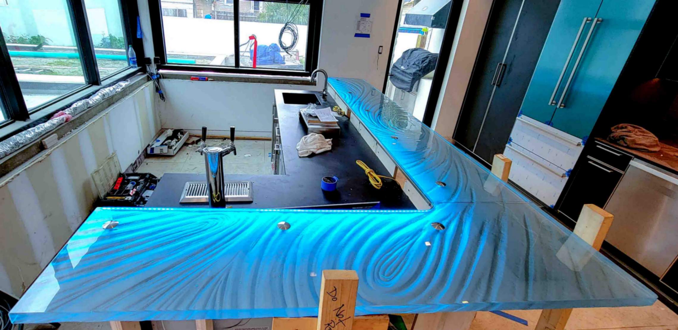 St Petersburg custom glass countertop and bar top with LED lights during installation by Downing Designs