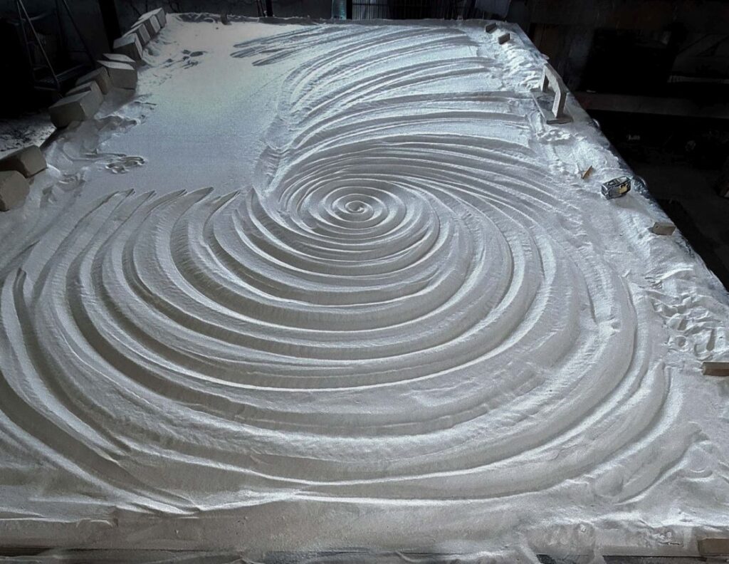 Kiln Carved sand bed for a thick textured glass countertop by Downing Designs