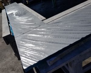 Textured underside of L shaped glass bar top showing sequenced pattern