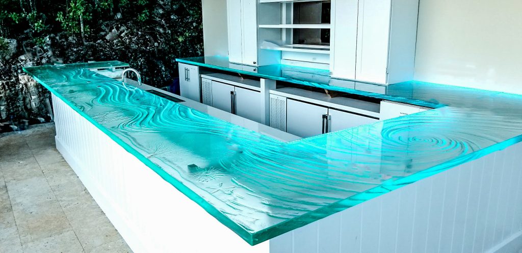 Kiln-formed glass bar top glowing aqua — private island Caribbean installation by Downing Designs Tampa — The Shape of Water seascape design
