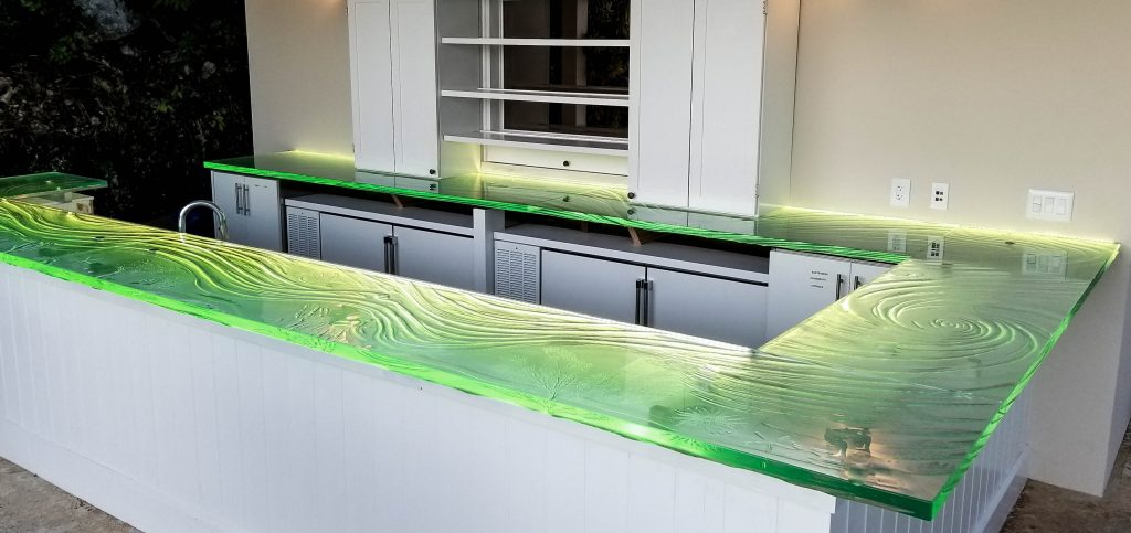 Kiln-formed glass bar top glowing green — private island Caribbean installation by Downing Designs — sea fan and turtle seascape texture
