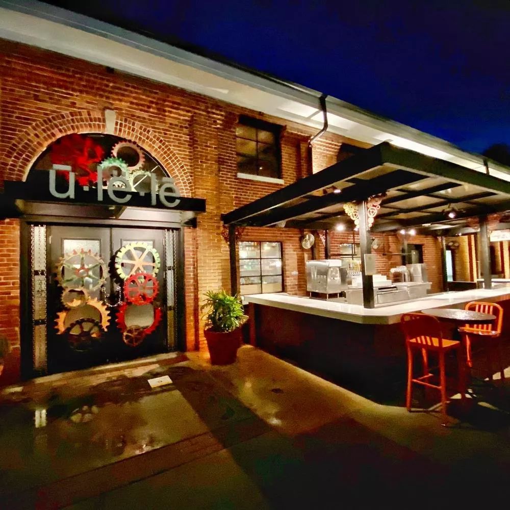 Ulele Restaurant Tampa white glass outdoor bar top at night