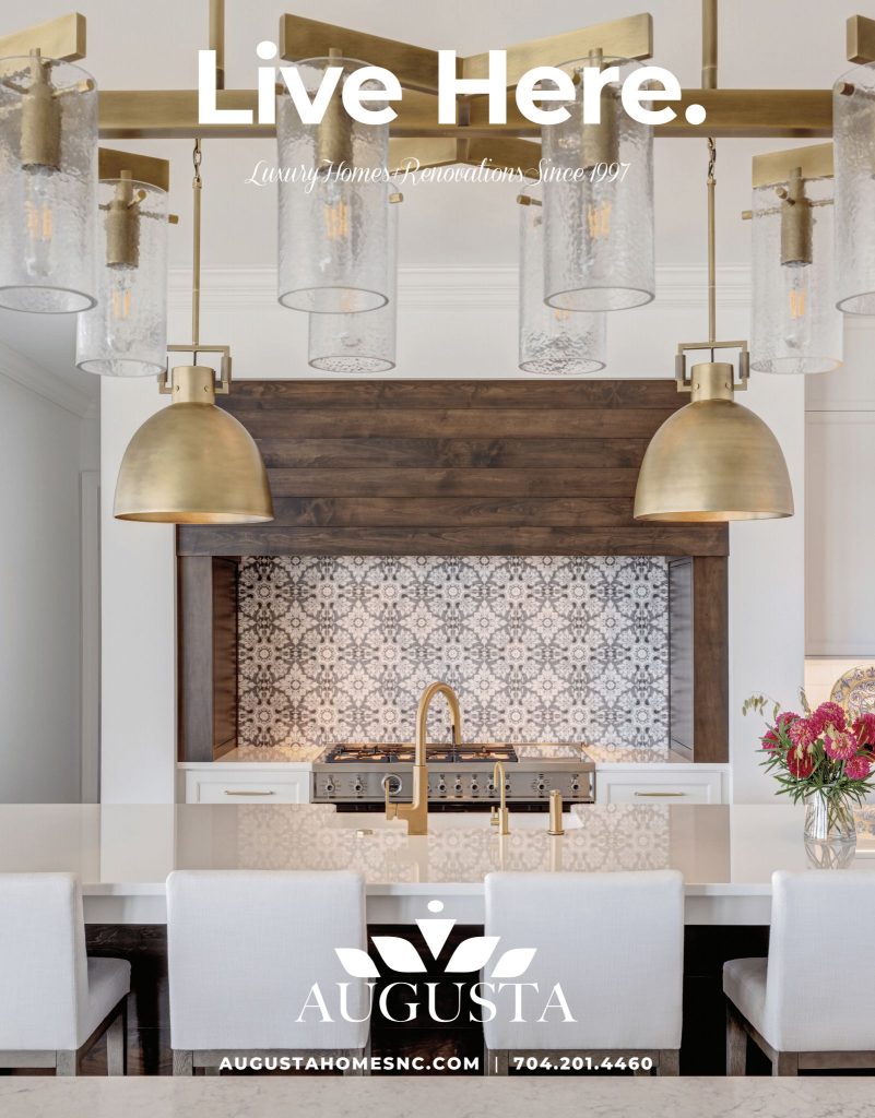 White glass island countertop by Downing Designs featured on Augusta Homes magazine cover — luxury kitchen renovation, Lake Norman, North Carolina